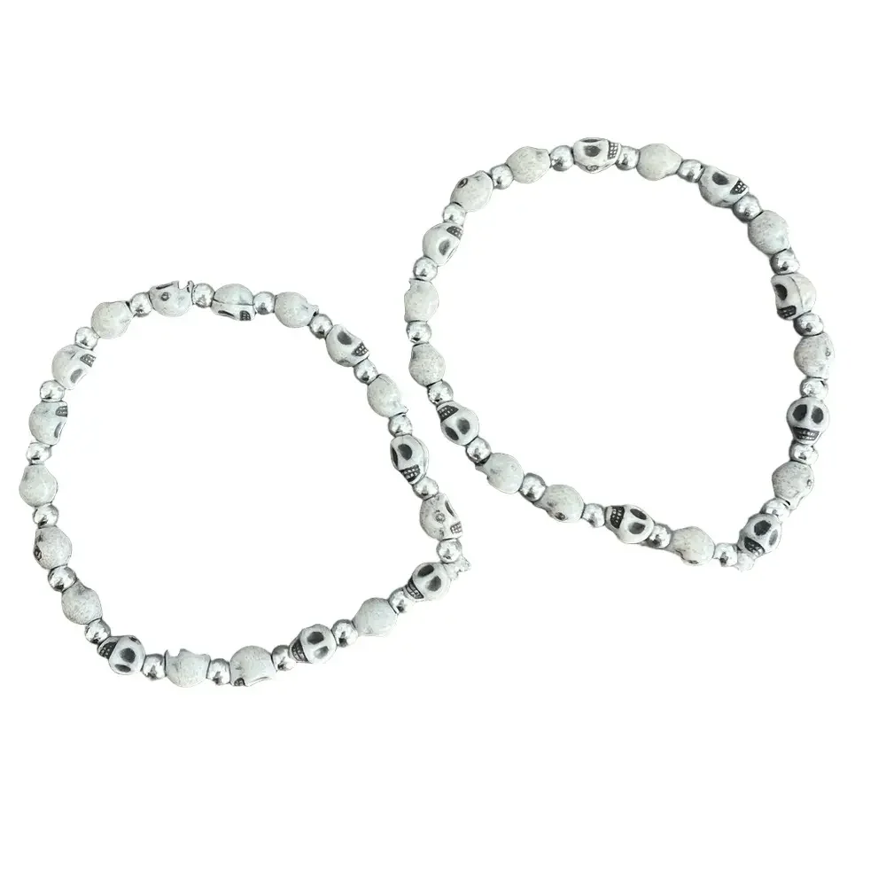Skull face and silver tone bead stretch bracelet set
